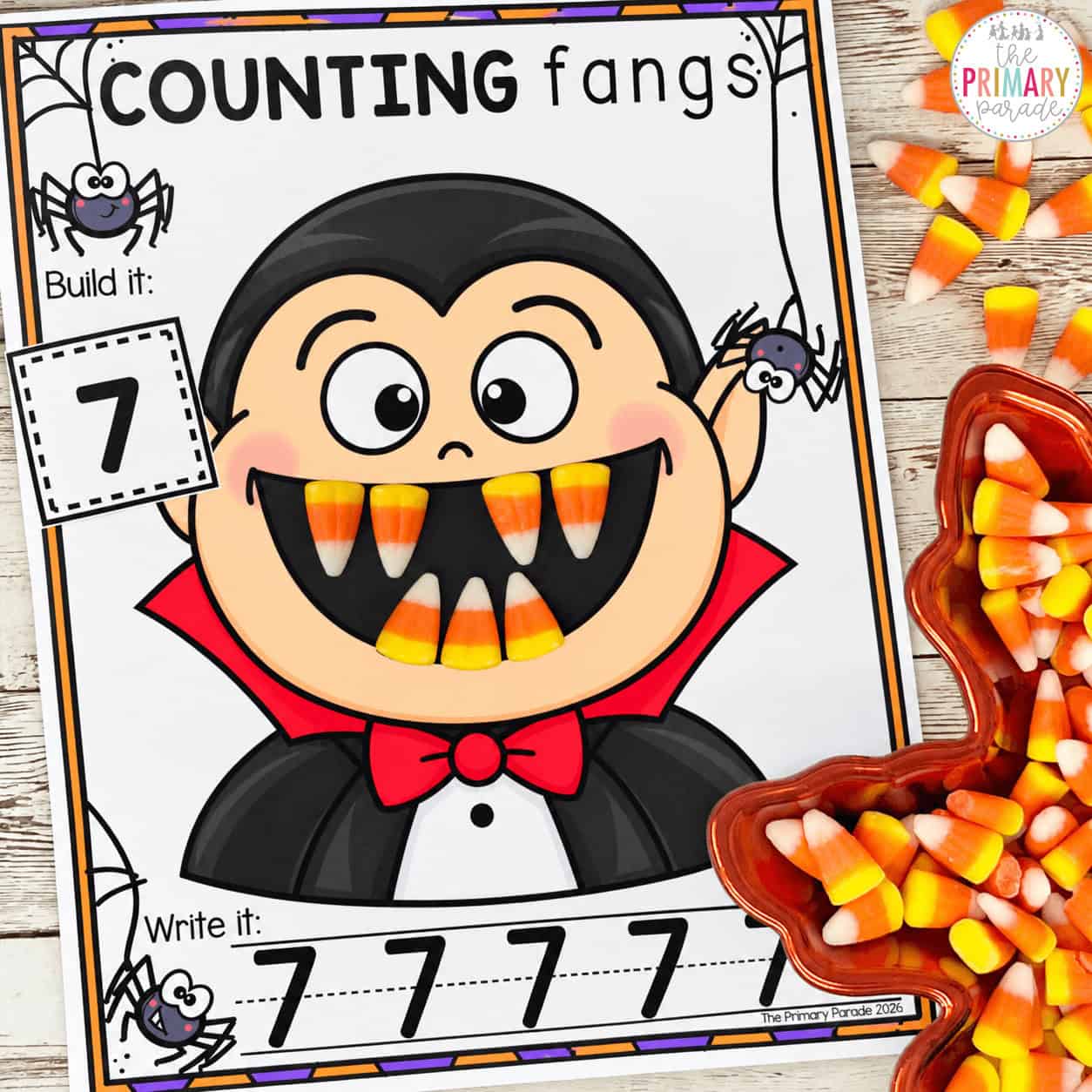 Halloween counting activity for preschool and kindergarten using candy corn fangs to practice number recognition, counting, and number writing.