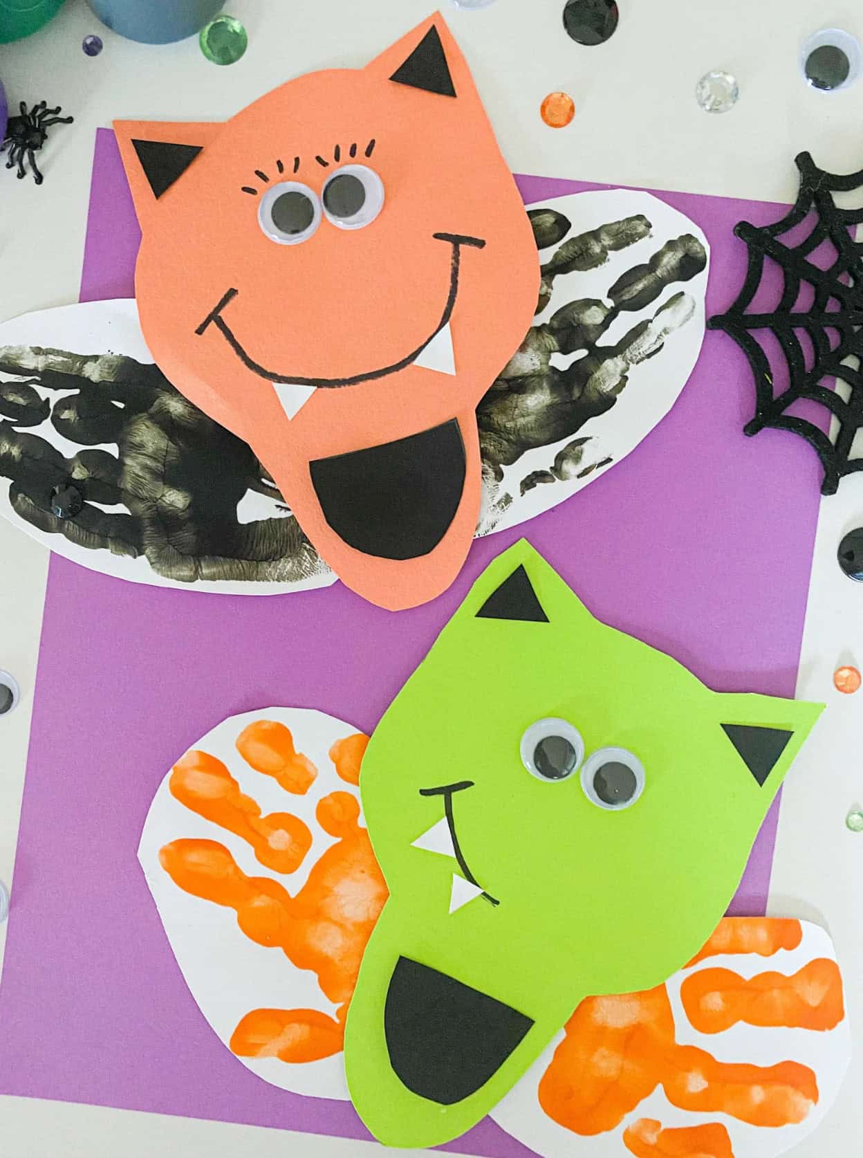 Colorful bats with painted handprint wings