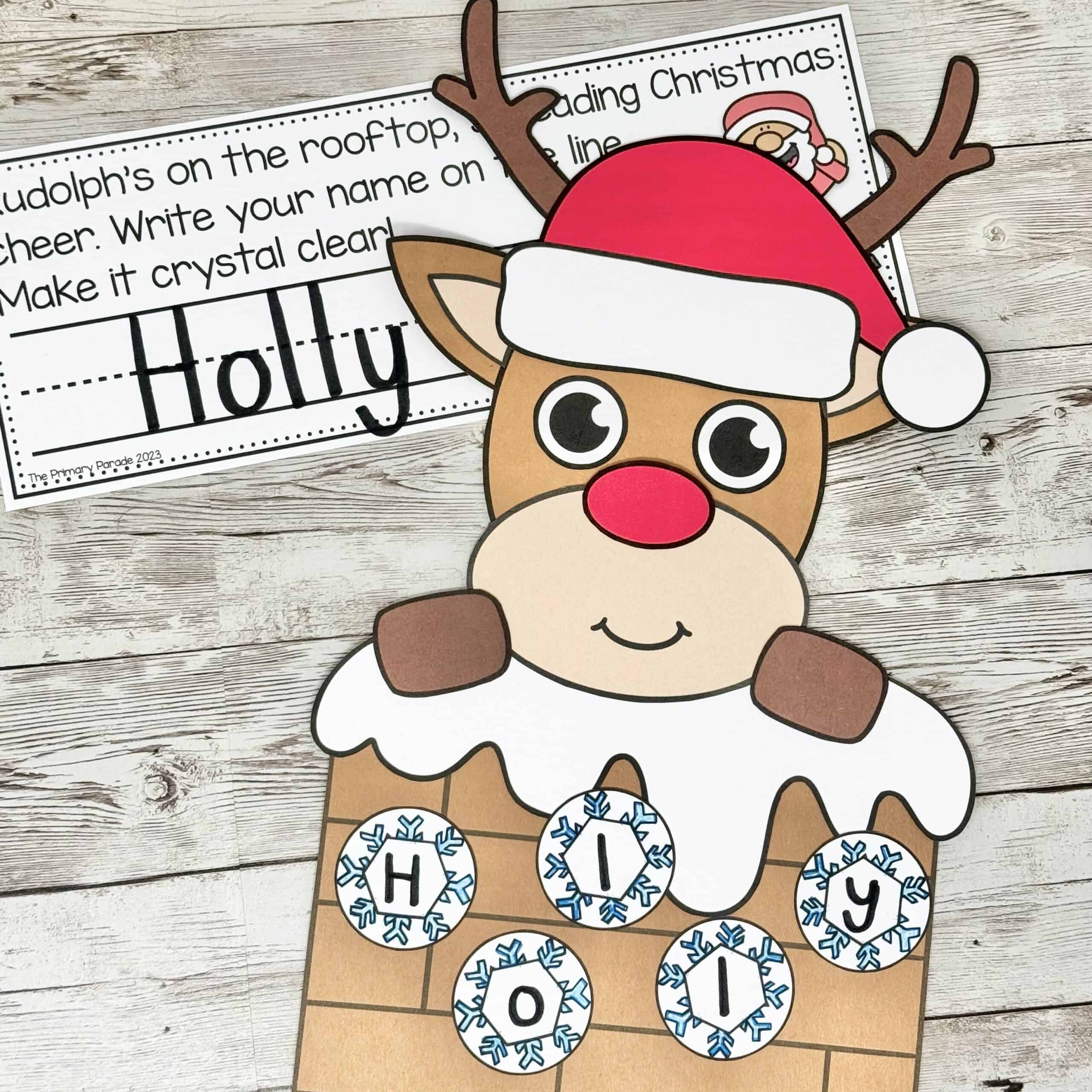 Rudolph reindeer rooftop Christmas name craft with a Santa hat, antlers, and a printable holiday name-writing worksheet