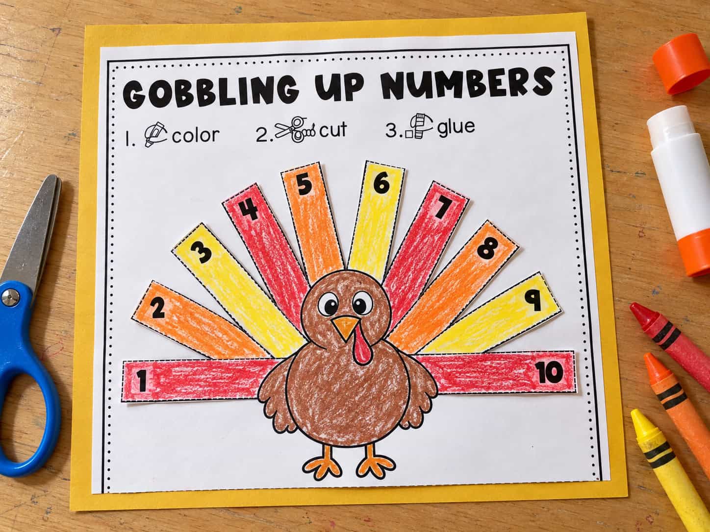Gobbling Up Numbers cut and paste worksheet with numbered turkey feathers